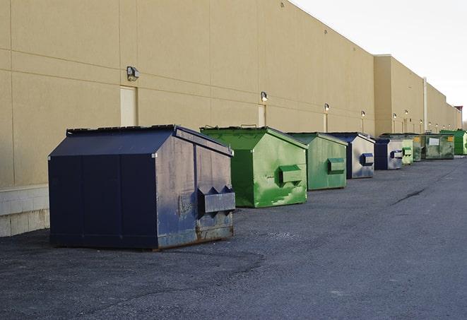 construction dumpsters stacked in a row on a job site in Bellwood